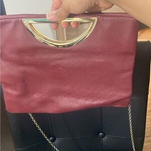 Elegant Burgundy Handbag with Gold Accents